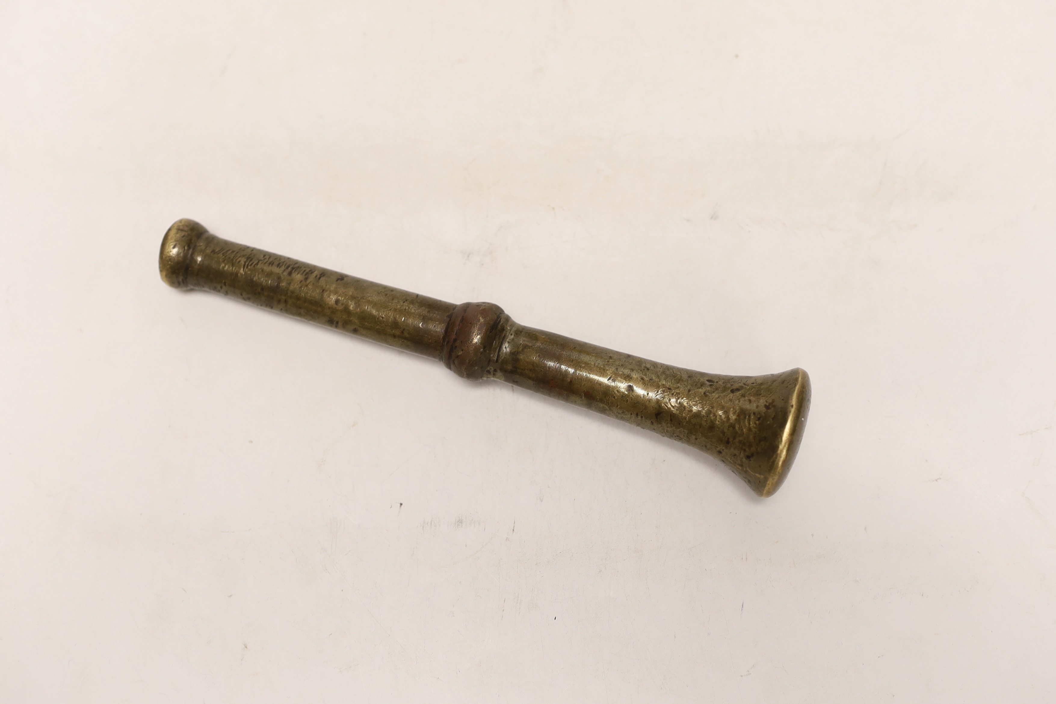 An antique bronze pestle and mortar, 15cm high
